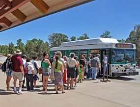 Park visitors boarding Village Route bus at the Transit Center.