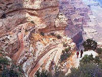 HIKERS PAUSE TO LOOK DOWN THE SWITCHBACKS AT THE START OF THE S. KAIBAB TRAIL. GRAND CANYON N.P. NPS PHOTO. 