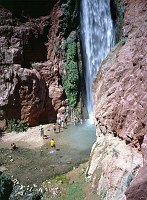 BOATERS RELAXING AT DEER CREEK FALLS, COLORADO RIVER MILE 136, GRAND CANYON N.P. NPS PHOTO. 